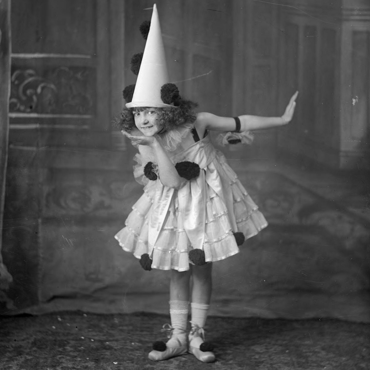 Child posing in Pierrot costume in 1915