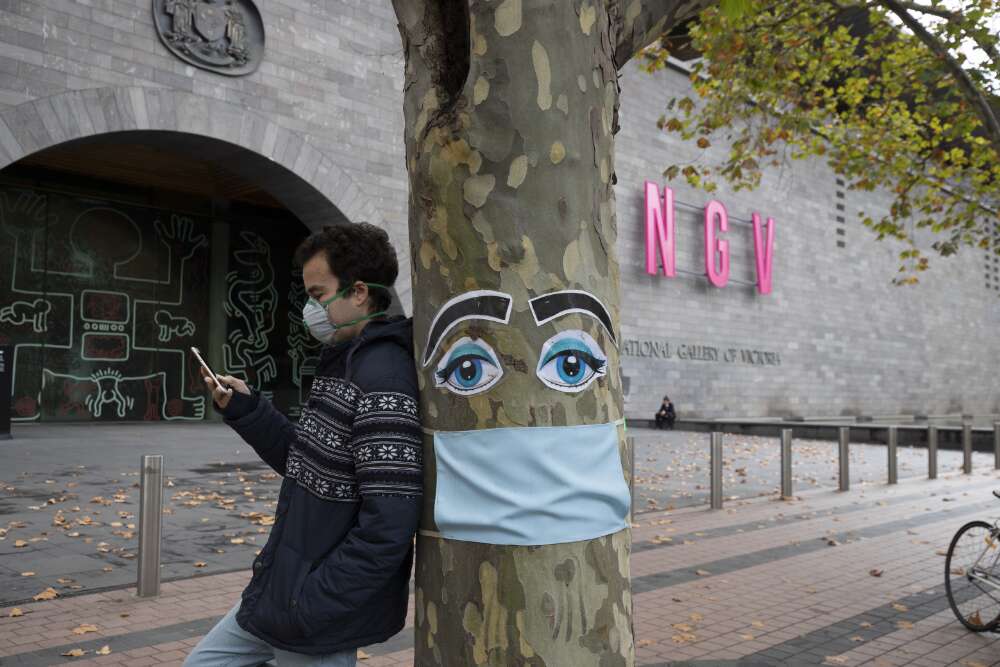 Henningham, Leigh. (). A tree decorated in face mask outside the National Gallery of Victoria, during the COVID-19 pandemic, Melbourne, Victoria, 26 April 2020