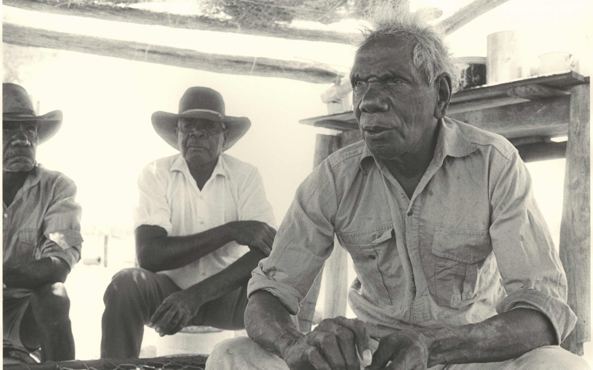 black and white photograph of three Aboriginal men