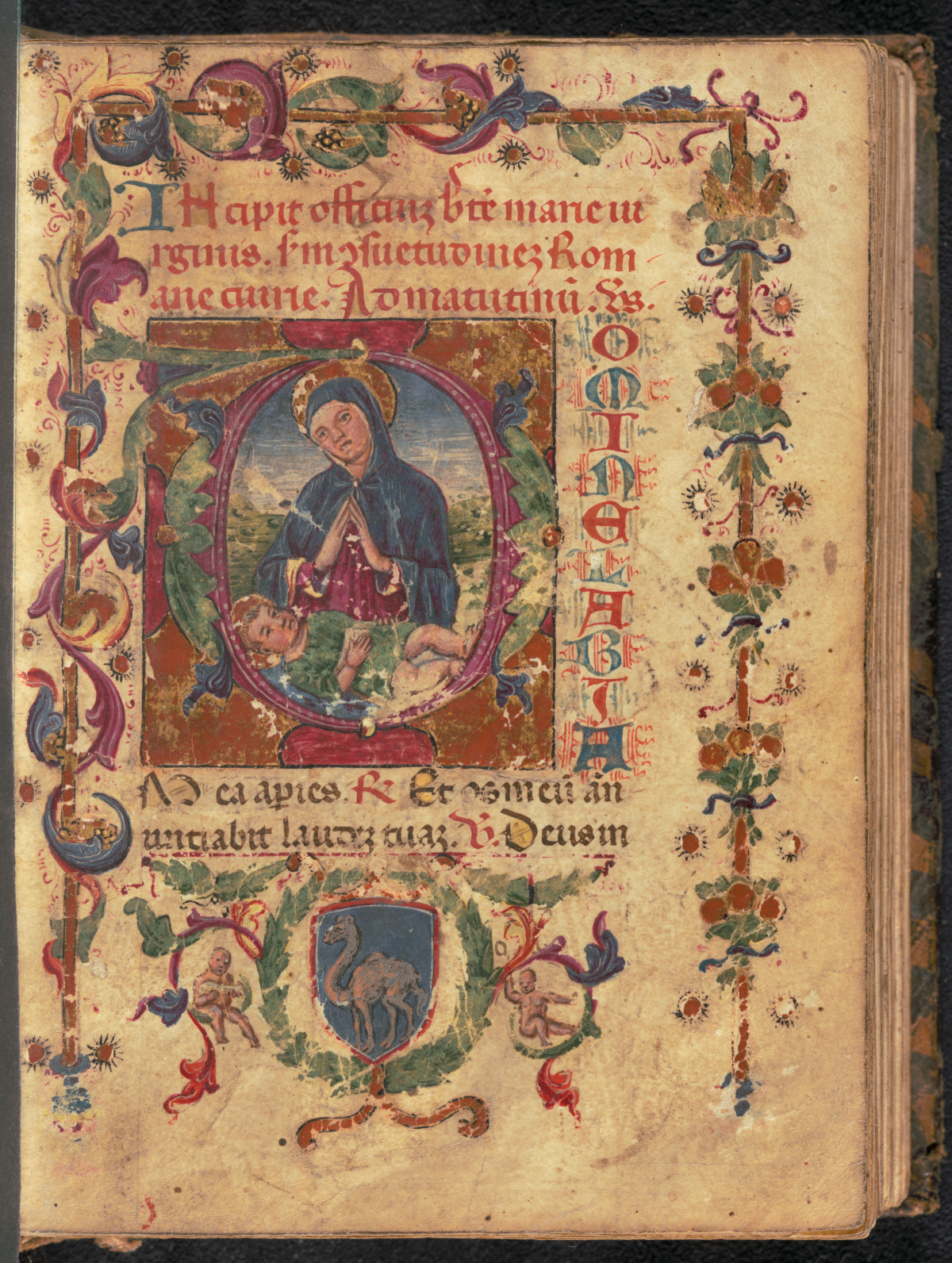 A highly decorated page from an old book. The border is brightly coloured with floral imagery. In the middle of a page is a hand drawn image of a woman framed in a circular frame. There is text written in red ink.