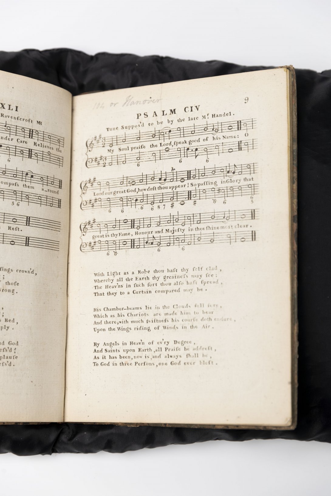 Old book open to music score of a psalm