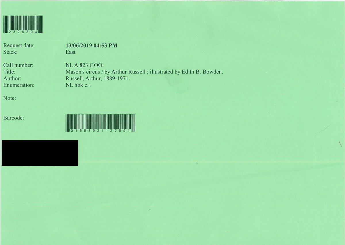 A printed call slip for a book on green paper