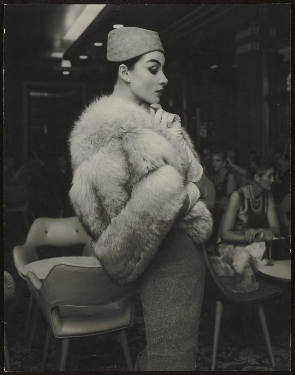 Model wearing skirt and fur stole, approximately 1965