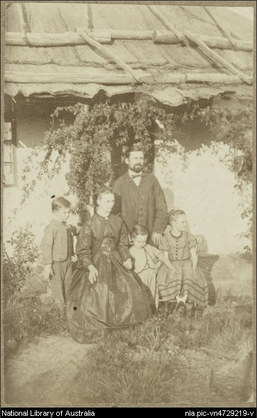 Family in front of cottage with bark roof, Hill End, New South Wales, ca.1872 [picture]. 