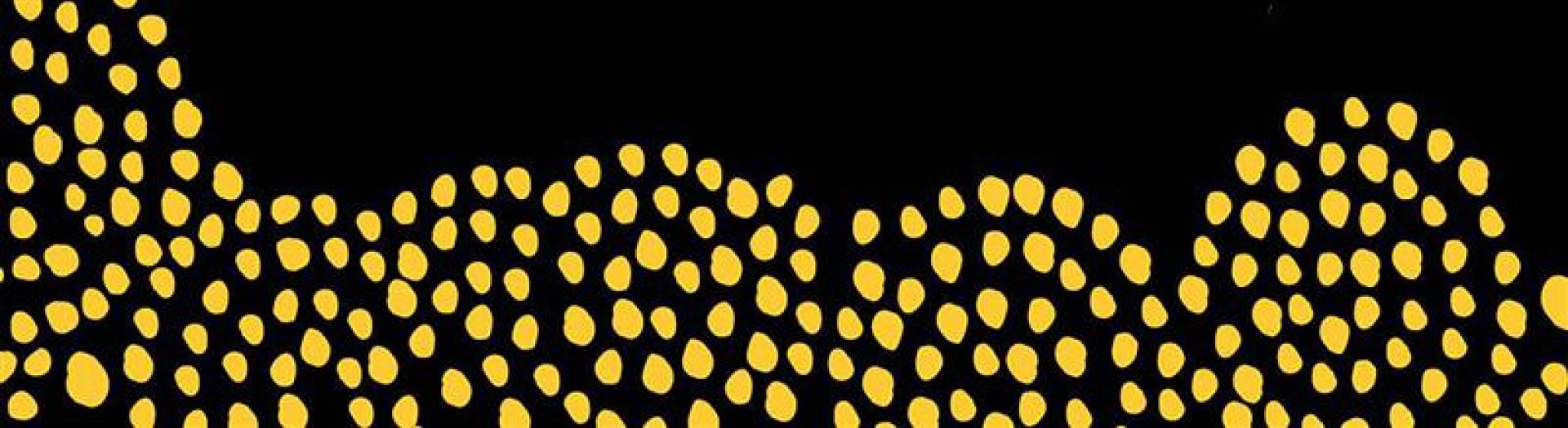 Yellow dots in circular patterns on a black background