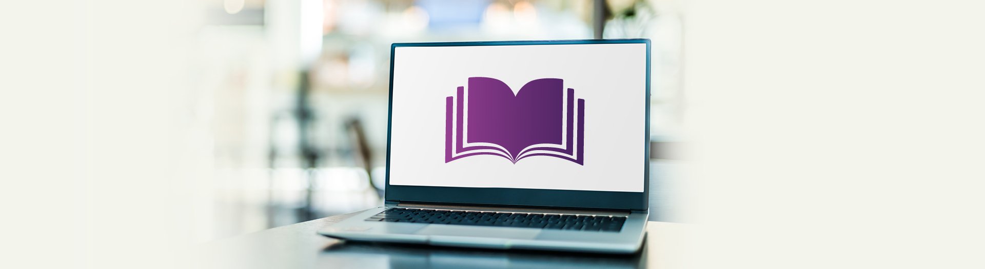 Image of a stylised open purple book on a laptop computer screen