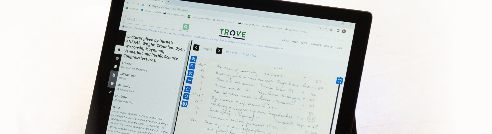 Close up of laptop showing Trove website. The screen displays a handwritten document on the right and information about it on the left. 