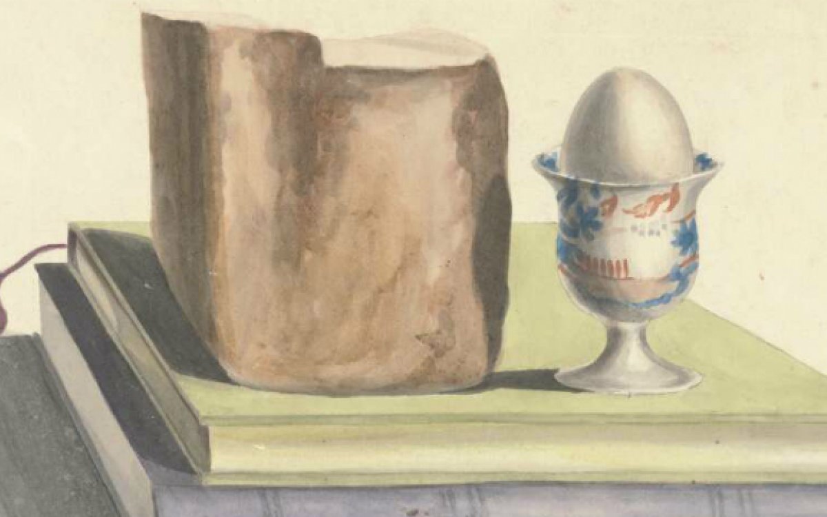 watercolour painting of a loaf of bread and an egg in an egg cup sitting on two books
