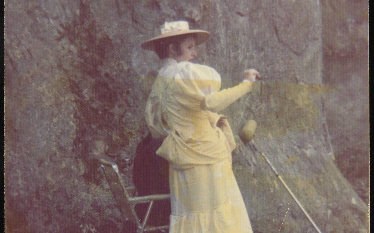 yellowed photo of woman in white georgian style dress