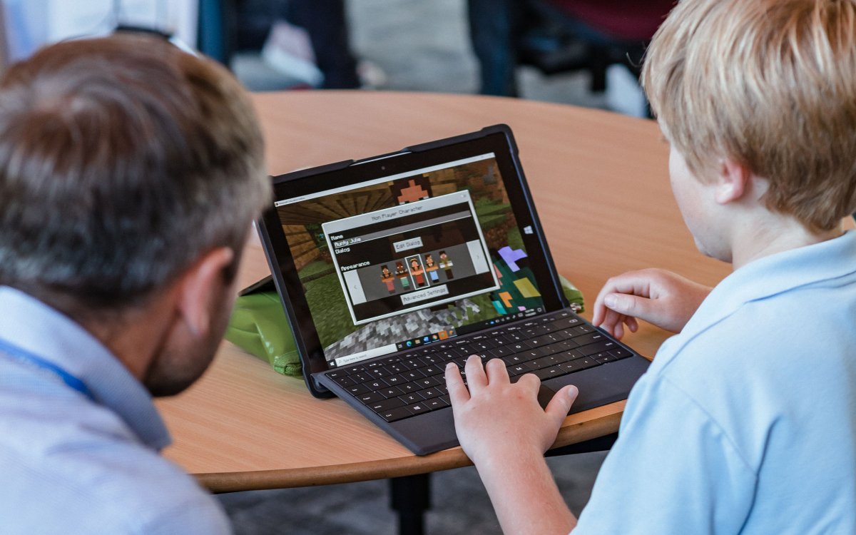 A primary school student uses computer program Minecraft