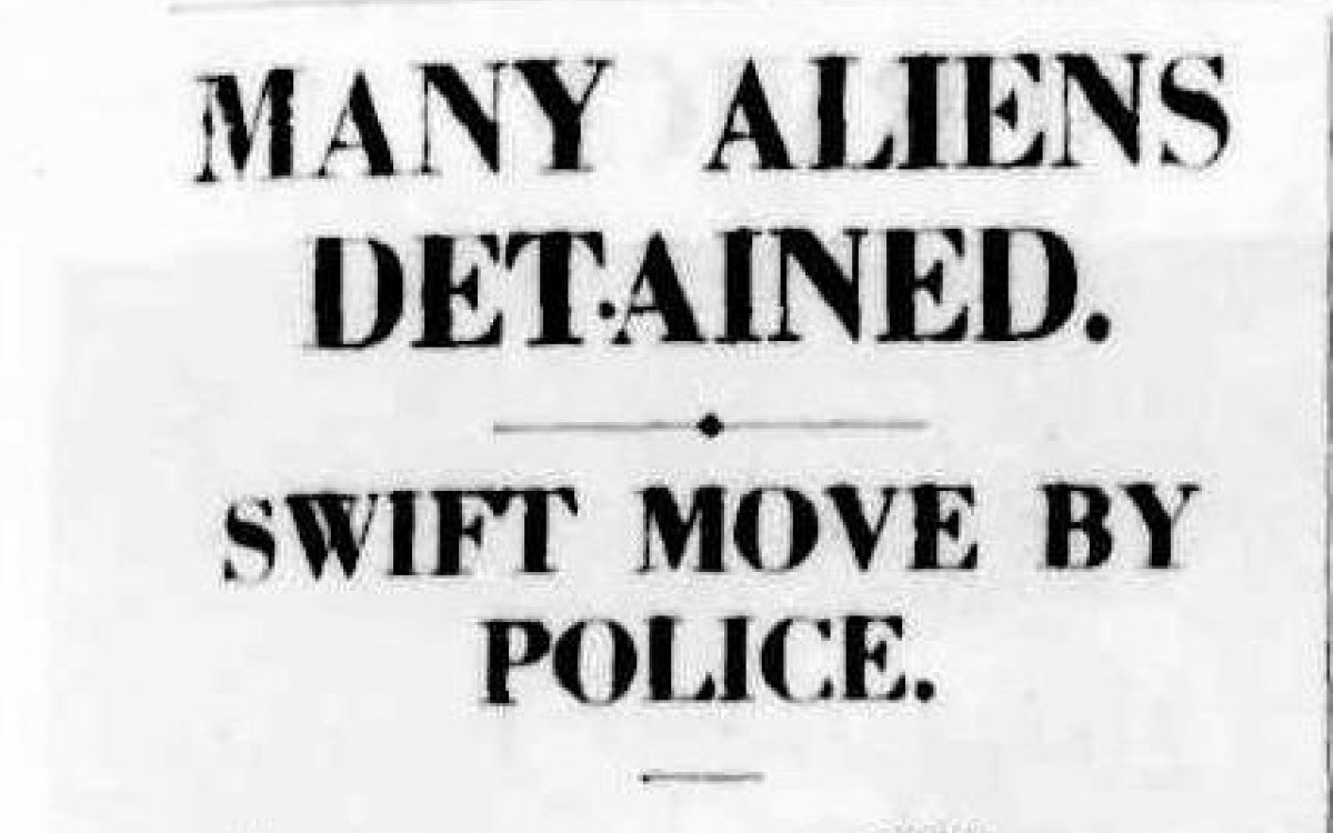 A newspaper article with the headline "Many aliens detained"