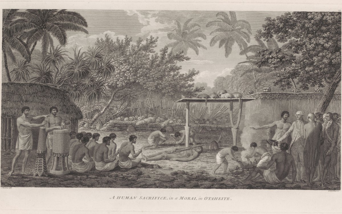 A ceremony is being conducted. Two men perform on drums while a group of men are seated facing the centre of the image. Another group are seated around a fire. To the very right of the foreground a Polynesian man gestures to the ceremony to a group of European men. In the centre of the image a man lies bound to a pole. Two other men are digging a hole. Lined up on the wall behind them is a collection of human skulls