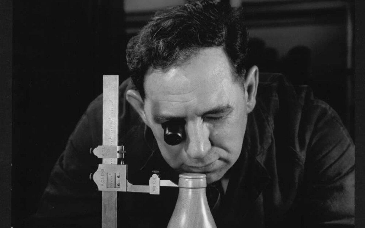 Man inspecting milk bottle pattern