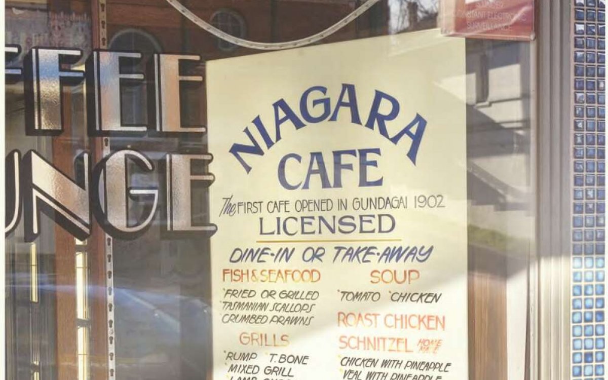 A photo of a menu in Greek displayed in a restaurant window in Gundagai, New South Wales. 