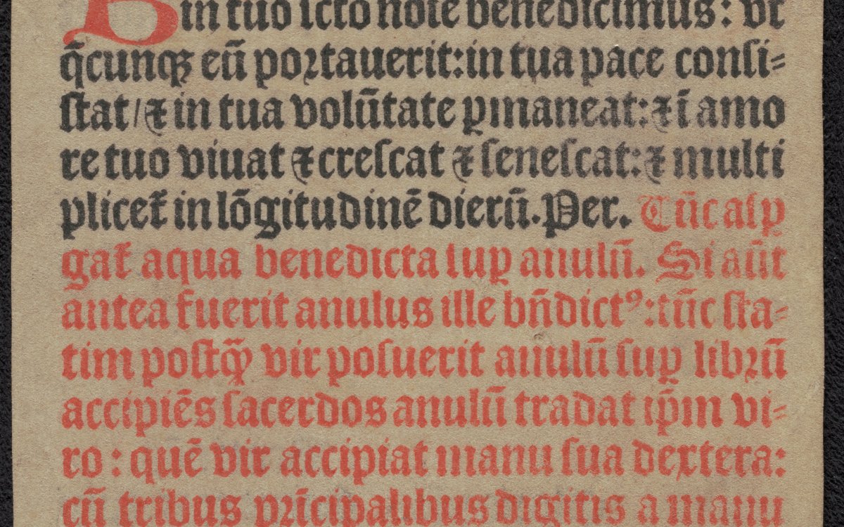 A manuscript written in old English text. Some text is red and some is black. It is missing a small fragment from the lower right corner.