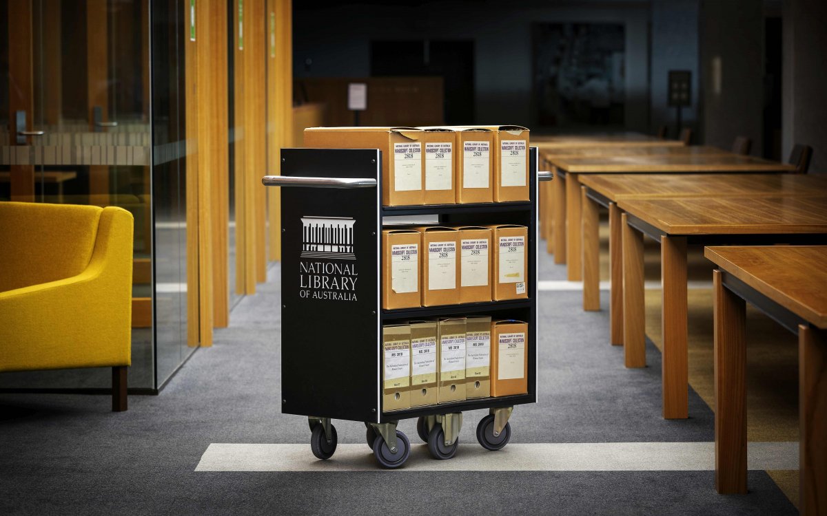 Image of archive boxes on a National Library of Australia trolley