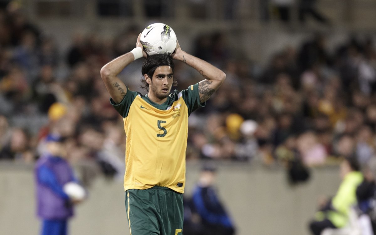Photo of Socceroo, Rhys Williams throwing a soccer ball over head