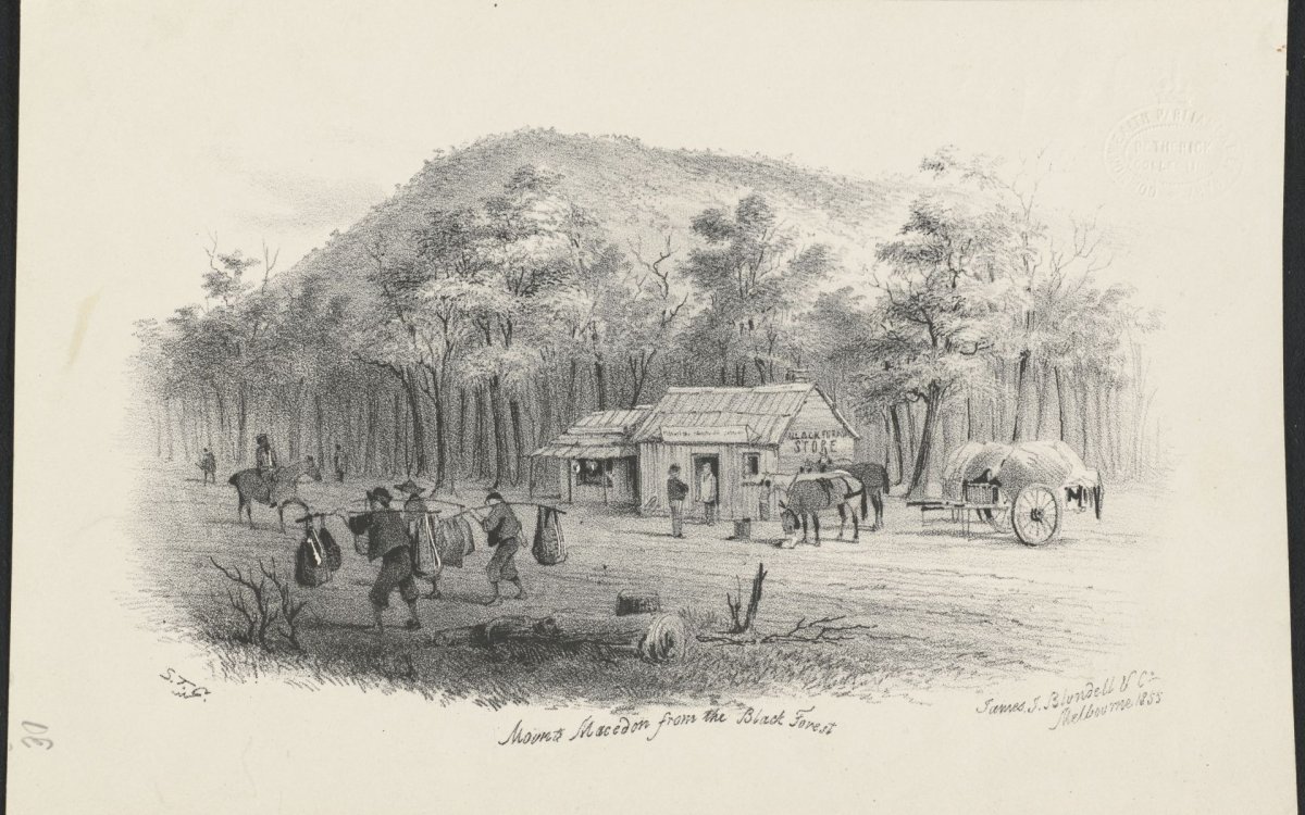 A black and white print  of a drawing of men with long poles and bags at either end carrying them along a road past a house with a couple watching next to 2 feeding horses and a cart of hay.