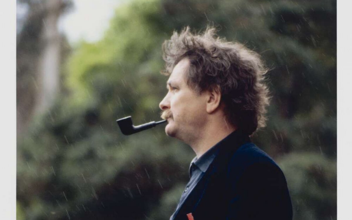 colour photograph of man smoking a pipe in profile