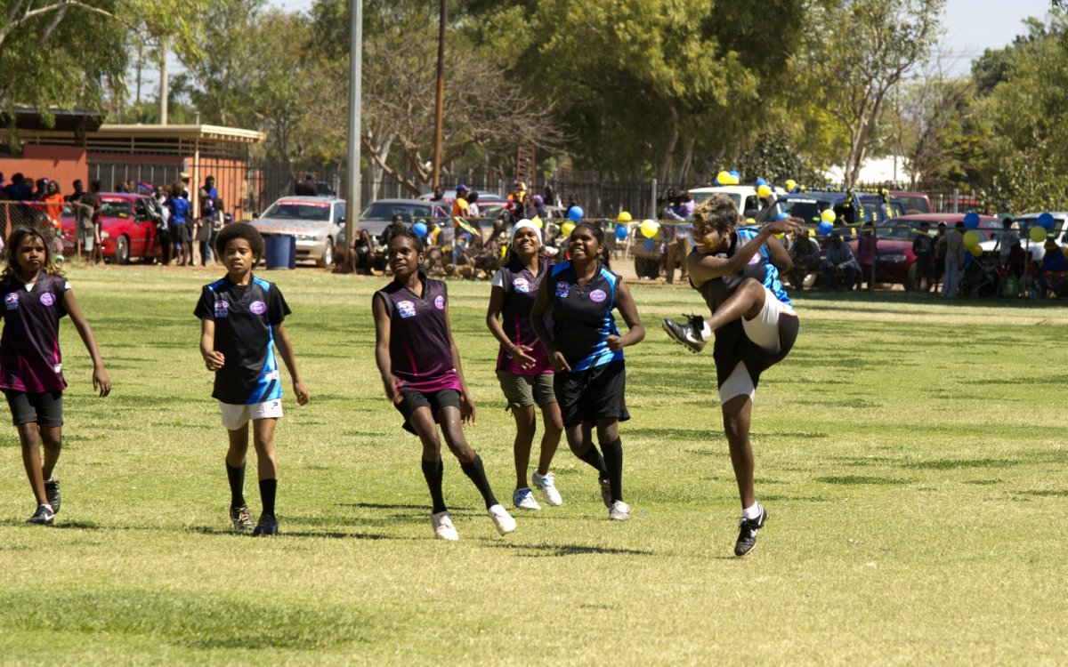 Photo of The Stronger Sisters playing football at the Tennant Creek football Grand Final, 2011