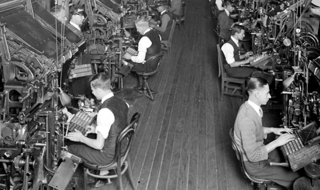 Men working on the linotype machines in the SMH building
