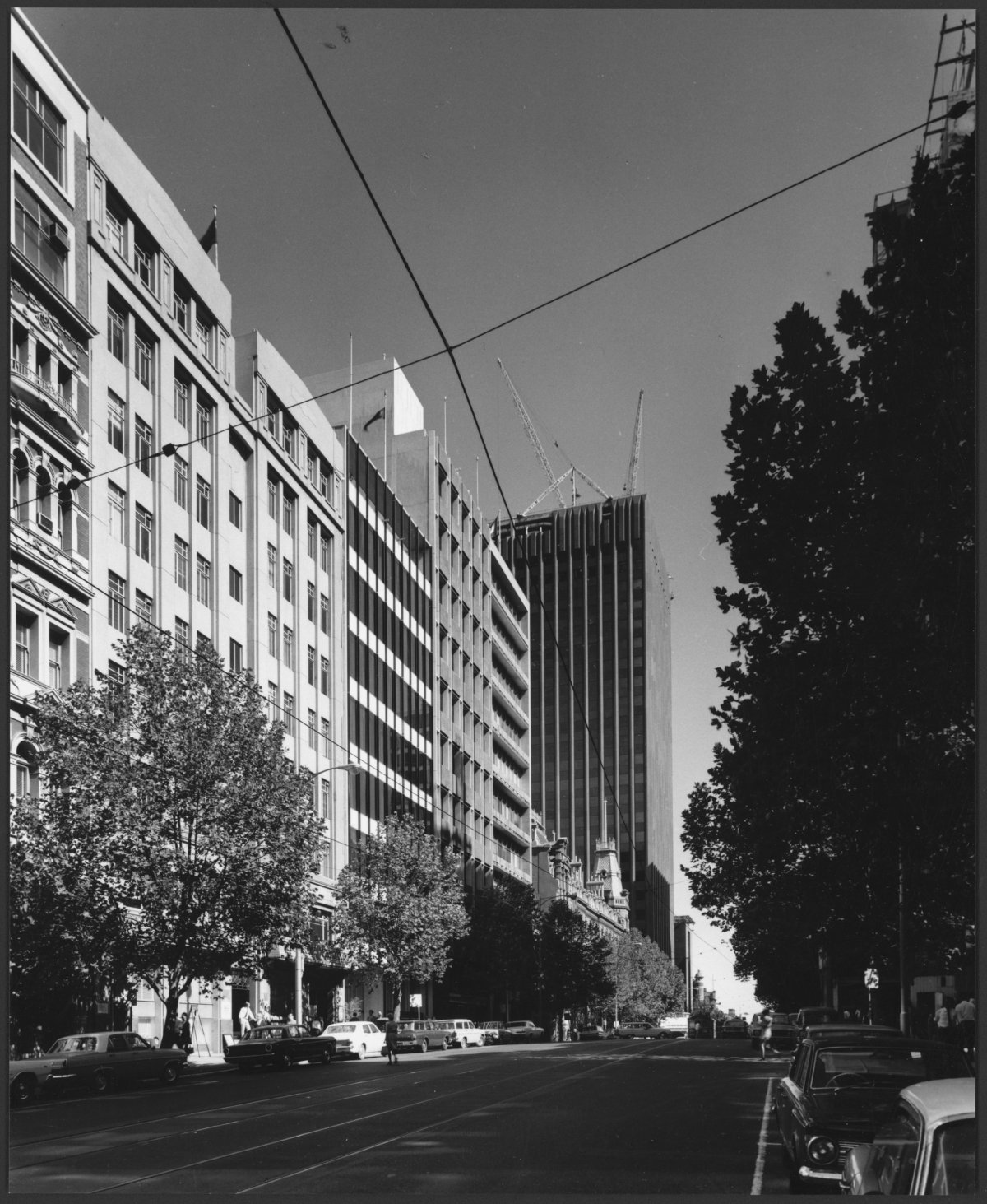 Bourke Street, looking west from Queen Street, with AMP-St. James building under construction, Melbourne, Victoria, 1969