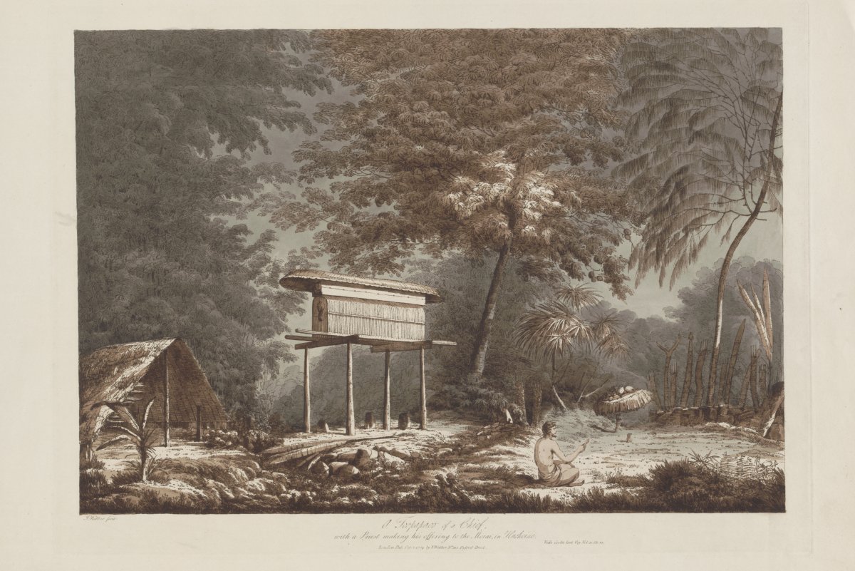 A clearing in a dense forest. A man is seated in the foreground. He is praying and making an offering. To his left stands a thatched hut on high stilts. To the left of the stilted hut is a smaller triangular hut with a thatched roof. The clearing is surrounded by  