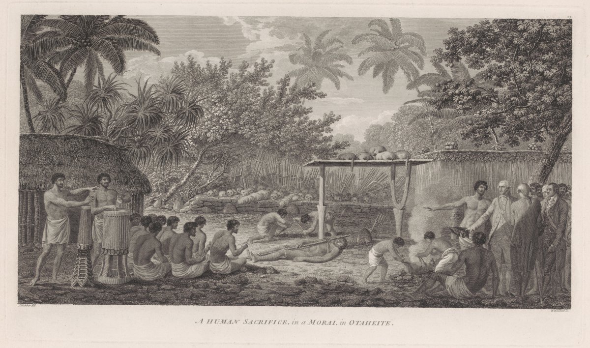 A ceremony is being conducted. Two men perform on drums while a group of men are seated facing the centre of the image. Another group are seated around a fire. To the very right of the foreground a Polynesian man gestures to the ceremony to a group of European men. In the centre of the image a man lies bound to a pole. Two other men are digging a hole. Lined up on the wall behind them is a collection of human skulls