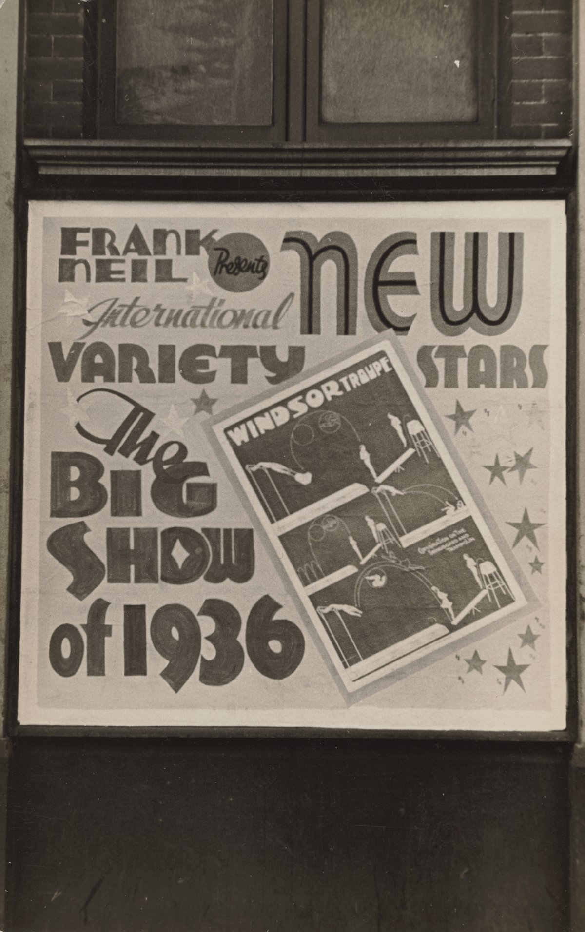 A black and white photograph of a billboard advertising the "Big Show of 1936", a variety performance