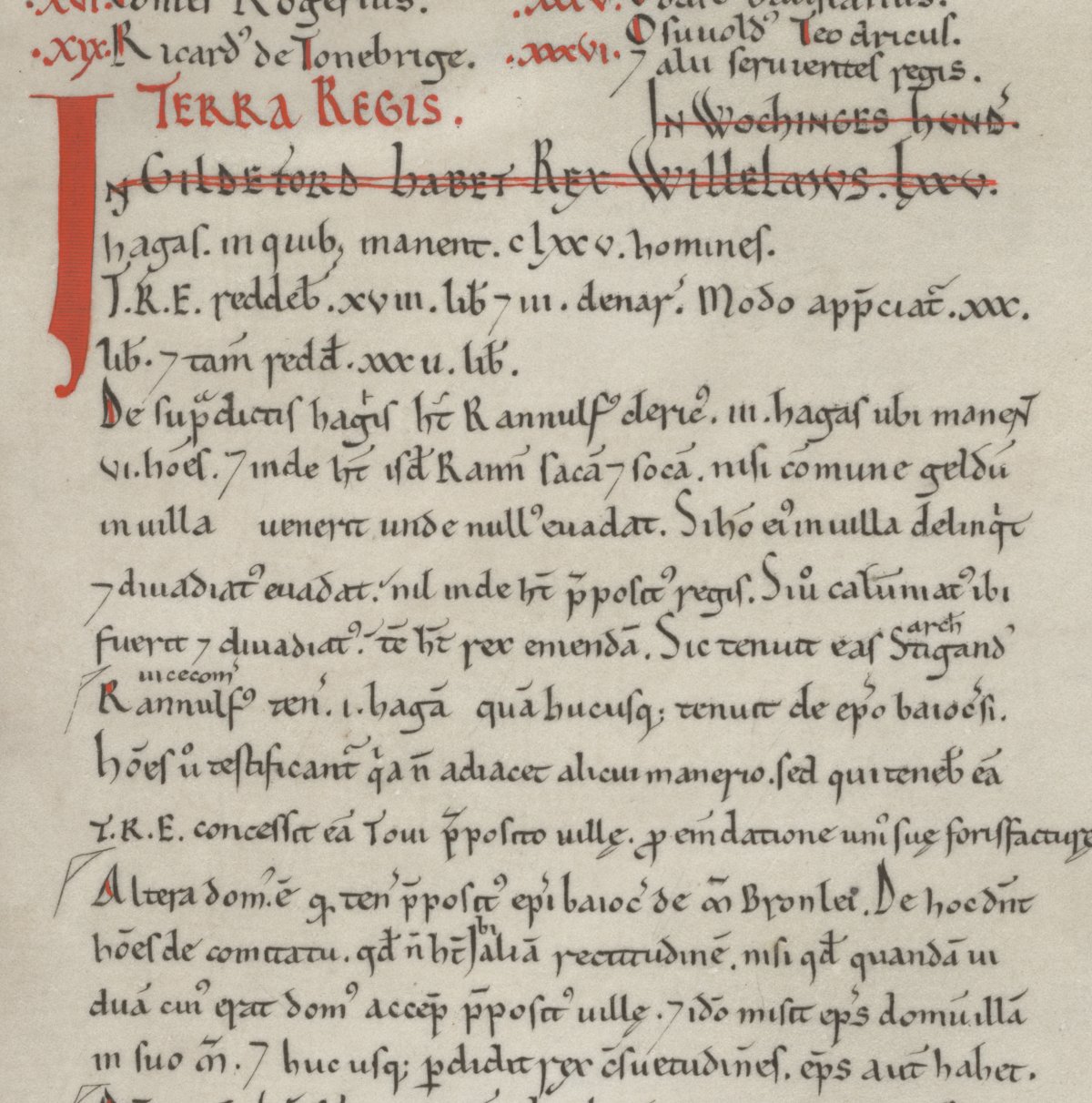 Inset from the Domesday Book. Most text is written in black ink. Some is in red. The words "Terra Regis" is written prominantly in red. The document is written in Latin and lists land owned in the county of Surrey