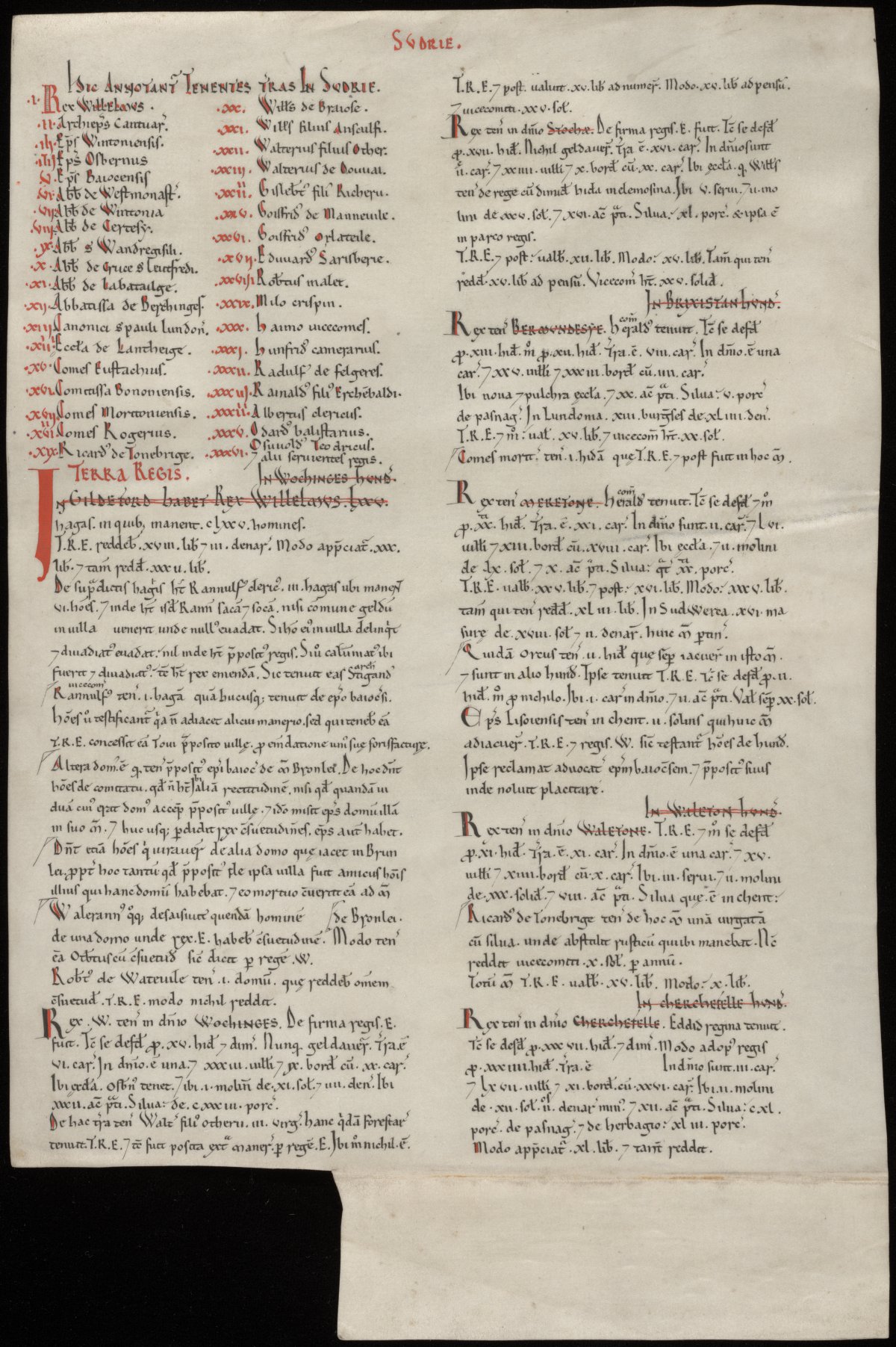 A facsimile copy of the Domesday Book. It is missing a square from the bottom left hand corner. Some of the text is black and some is red.