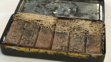 An open tin of Boer War chocolates