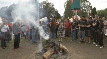 Crowd at the Aboriginal Tent Embassy gathered around the smoking ceremony to mark the Apology to the Stolen Generations