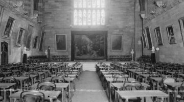 Rows of desks and tables set up for exam in the Sydney University Great Hall