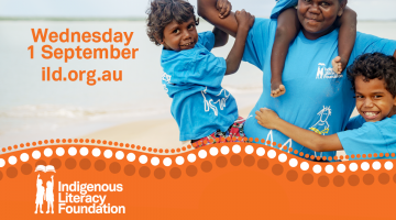 Image of four Indigenous children in blue shirts with text proudly celebrating Indigenous Literacy Day