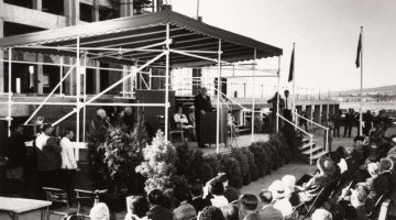Black and white photograph of Sir Robert Menzies addressing a crowd at the opening of the National Library in Canberra