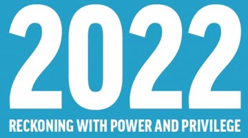 White text on a blue background. The text reads '2022 reckoning with power and privilege'.