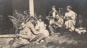 Soldiers in uniform and ladies knitting