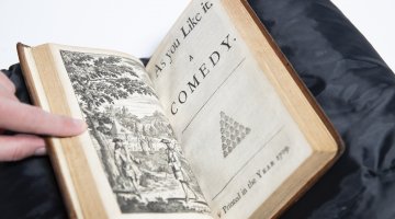 Old book open to page reading 'A Midfummer Night's Dream: A comedy'