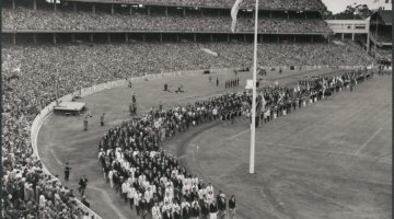 Black and white photo of athletes marching during the closing ceremony of the 1956 Melbourne Olympics