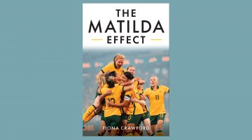 The book cover for 'The Matilda Effect' by Fiona Crawford. The image on the cover shows 7 women in Australian team soccer uniforms jumping, cheering and hugging one another.