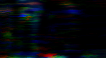 A black background with red, blue and green strobing effects on it.