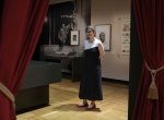 Dr Susannah Helman stands in the On Stage exhibition gallery.