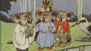 A group of animals wearing clothes. They are standing near a stream.