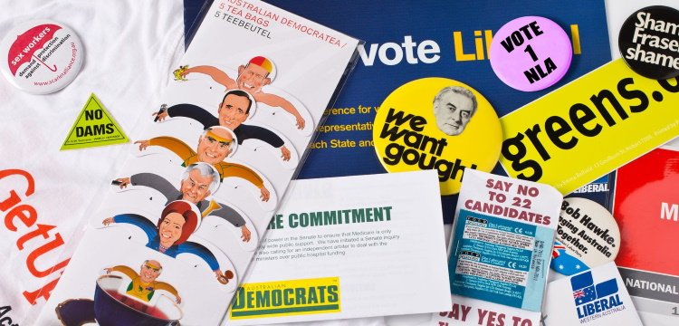 Australian Political party election material including Tea bag with images of Prime Ministers, badges, No Dams sticker, Get Up t-shirt, Greens bumper sticker. 