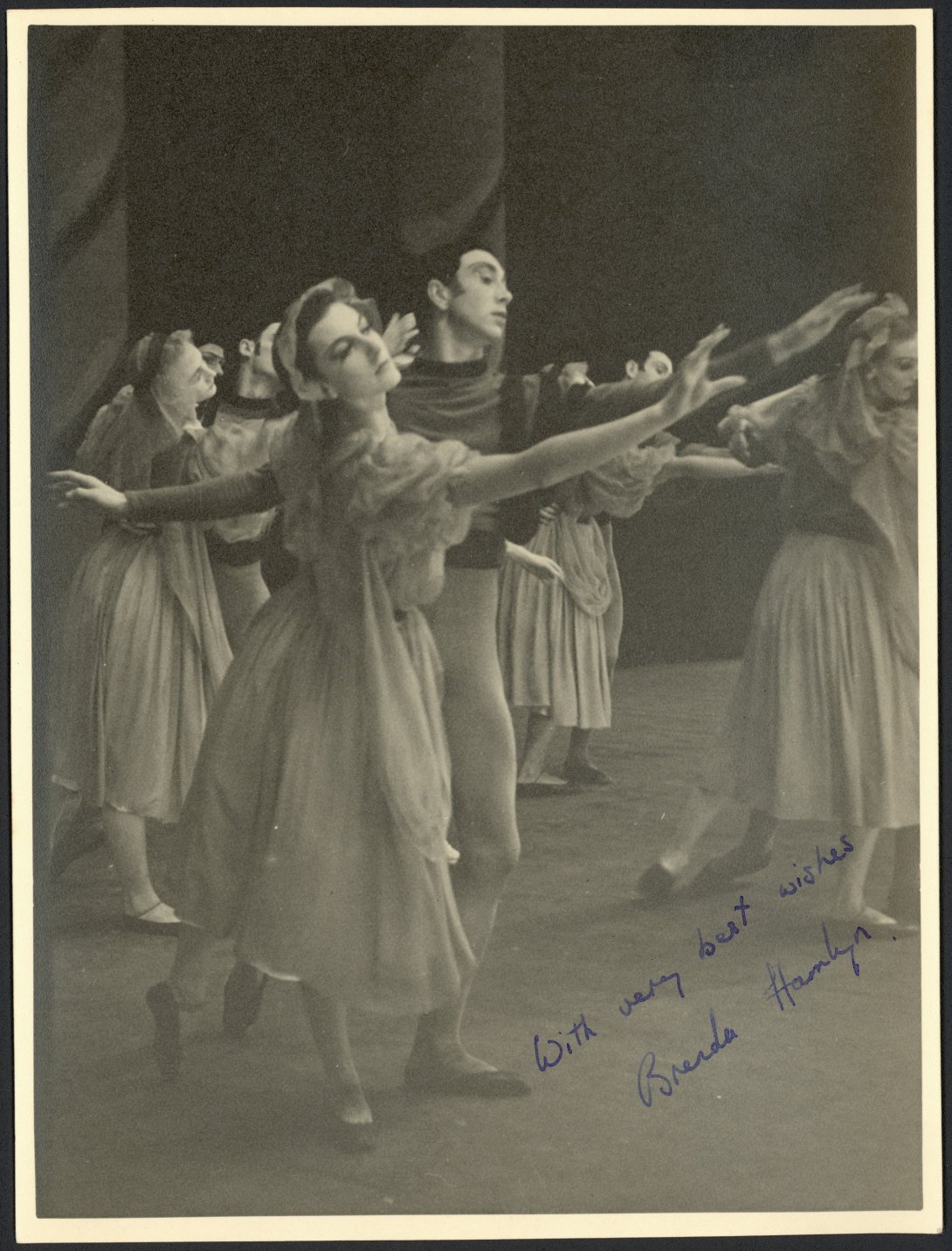 Black and white photograph of a group performing a waltz
