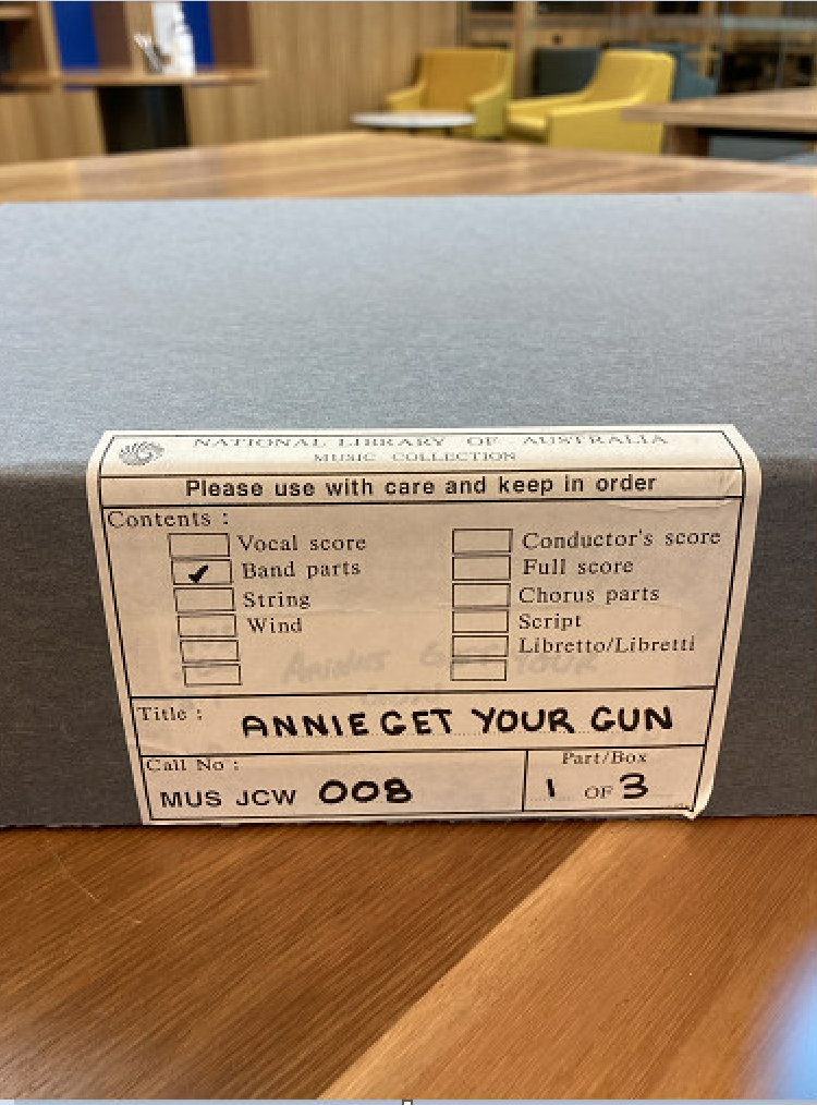 A label on a box file reads 'Annie Get Your Gun'