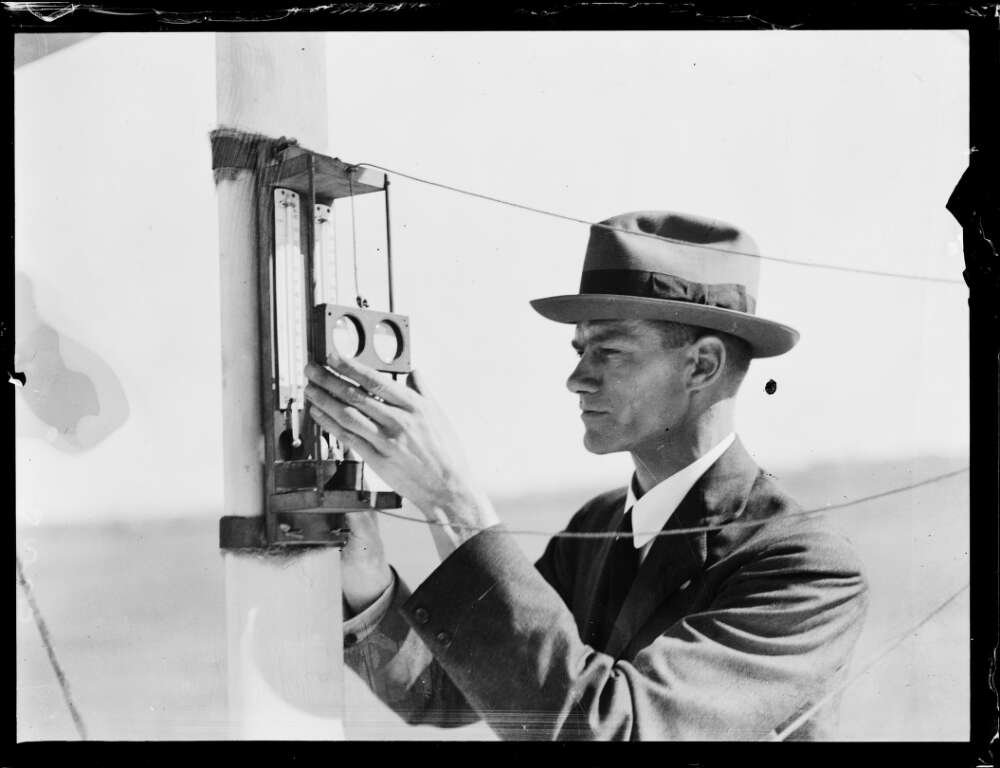 Meteorologist Edward Timcker reading the temperature on a thermostat at the Bureau of Meteorology in New South Wales in the 1920s.