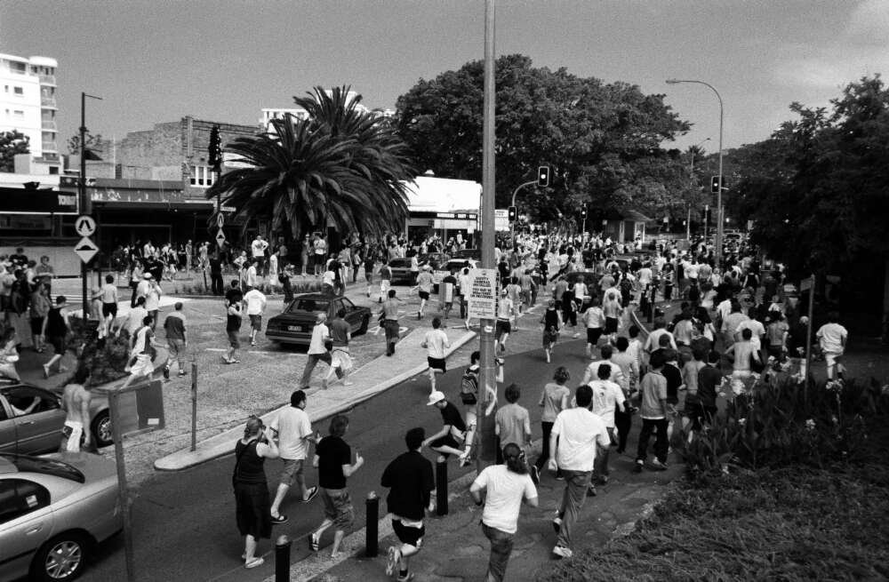 Hundreds of rioters run up Cronulla Street for the Cronulla Railway station where an attack on men of Middle eastern appearance followed, during the race riots in Cronulla, 11 December 2005 