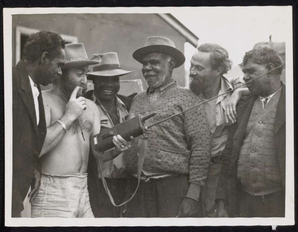 Peter Finch with Al Thomas and four Australian Aboriginal men on the set of Eureka Stockade, Singleton, 1947 